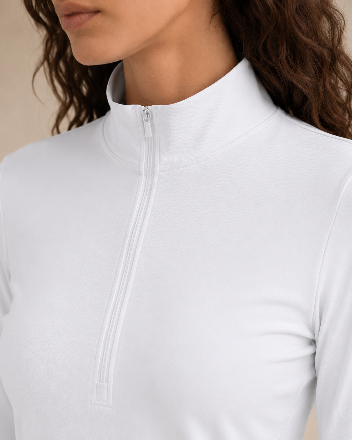 Close-up of the NORTHE Studio Form Jacket in Frost, a soft white shade, showing the half-zip neckline and fabric detail.
